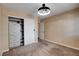 Bedroom with a closet and modern lighting, offering a calm and neutral space at 6117 Foxcroft Ave, Las Vegas, NV 89108