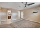 Unstaged bedroom with tile entryway and a view of the bathroom at 6117 Foxcroft Ave, Las Vegas, NV 89108