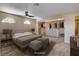 Staged bedroom featuring a ceiling fan and an organized closet with built-in shelving at 6117 Foxcroft Ave, Las Vegas, NV 89108