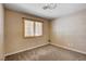 Bedroom featuring carpet and window with shutters at 6117 Foxcroft Ave, Las Vegas, NV 89108