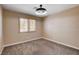 Bedroom features modern lighting, neutral colors and a window with plantation shutters at 6117 Foxcroft Ave, Las Vegas, NV 89108