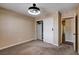 Bedroom features modern lighting, neutral colors and a closet with built-ins at 6117 Foxcroft Ave, Las Vegas, NV 89108