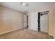 Bedroom with plush carpet, closet, and built in storage at 6117 Foxcroft Ave, Las Vegas, NV 89108