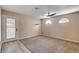 Bonus room with carpet, glass exterior door and arched windows providing natural light at 6117 Foxcroft Ave, Las Vegas, NV 89108