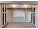 Custom designed walk-in closet with ample storage, drawers, and built-in organizers with glass doors at 6117 Foxcroft Ave, Las Vegas, NV 89108