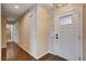 Inviting hallway with hardwood floors and access to multiple rooms at 6117 Foxcroft Ave, Las Vegas, NV 89108