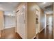 Hallway leading to bathroom with hardwood floors and recessed lights at 6117 Foxcroft Ave, Las Vegas, NV 89108