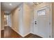 Inviting entryway featuring hardwood floors and stylish front door at 6117 Foxcroft Ave, Las Vegas, NV 89108