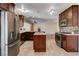 Well-appointed kitchen features stainless steel appliances and central island at 6117 Foxcroft Ave, Las Vegas, NV 89108