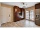 Bright eat-in kitchen features large cabinets, French doors, and stainless steel refrigerator at 6117 Foxcroft Ave, Las Vegas, NV 89108