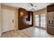 Eat-in kitchen area featuring modern lighting and wood cabinets with stainless steel appliances at 6117 Foxcroft Ave, Las Vegas, NV 89108