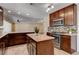 Bright kitchen with granite countertops, stainless steel appliances, generous counter space, and seamless flow to living room at 6117 Foxcroft Ave, Las Vegas, NV 89108