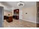 Open kitchen with tiled floors, an island, and modern appliances at 6117 Foxcroft Ave, Las Vegas, NV 89108