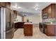 Spacious kitchen features stainless steel appliances, an island, and plenty of cabinet space at 6117 Foxcroft Ave, Las Vegas, NV 89108