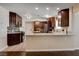 Modern kitchen with granite countertops, stainless steel appliances, and tiled floors at 6117 Foxcroft Ave, Las Vegas, NV 89108