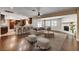 Open floor plan with hardwood floors connecting the kitchen and living spaces at 6117 Foxcroft Ave, Las Vegas, NV 89108