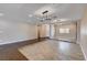 Expansive living area featuring neutral paint and stylish lighting at 6117 Foxcroft Ave, Las Vegas, NV 89108