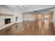 Large living room with hardwood floors and fireplace at 6117 Foxcroft Ave, Las Vegas, NV 89108