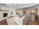 Bright living room boasts hardwood floors and connects to the dining area at 6117 Foxcroft Ave, Las Vegas, NV 89108