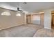 Spacious main bedroom with custom built-in cabinets, carpet, and ceiling fan at 6117 Foxcroft Ave, Las Vegas, NV 89108