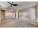 Spacious main bedroom with a ceiling fan and custom built-in closet organizers and drawers at 6117 Foxcroft Ave, Las Vegas, NV 89108