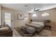 Cozy bedroom with modern ceiling fan, stylish accents, and natural light at 6117 Foxcroft Ave, Las Vegas, NV 89108