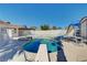 Sparkling pool with diving board and slide, perfect for summer fun, in fenced backyard at 6117 Foxcroft Ave, Las Vegas, NV 89108