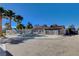 Backyard pool features mature landscaping and a slide at 6117 Foxcroft Ave, Las Vegas, NV 89108