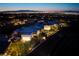 Aerial view of a modern estate with stunning city views at night, showcasing elegant landscaping at 621 Majestic Rim Dr, Henderson, NV 89012