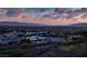 Scenic aerial view of luxury homes and golf course with city views, nestled in a beautiful landscape at 621 Majestic Rim Dr, Henderson, NV 89012