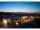 Modern home with city skyline view, featuring contemporary architecture and well-manicured landscaping at 621 Majestic Rim Dr, Henderson, NV 89012