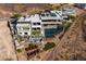 Expansive aerial view showcasing the modern home's sprawling layout, pool, and landscaped grounds at 621 Majestic Rim Dr, Henderson, NV 89012
