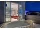 Outdoor balcony featuring a stylish daybed with city views, easily accessible from the adjacent office space at 621 Majestic Rim Dr, Henderson, NV 89012