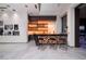 Modern home bar with unique zebra-striped details, stylish seating, and contemporary lighting at 621 Majestic Rim Dr, Henderson, NV 89012