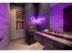 Chic bathroom with modern fixtures, marble wall, and neon art at 621 Majestic Rim Dr, Henderson, NV 89012