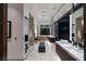 Bright bathroom with modern fixtures, a soaking tub, and an open design showcasing outdoor scenery at 621 Majestic Rim Dr, Henderson, NV 89012