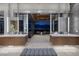 Elegant dual vanity bathroom with city views, natural light, and a contemporary seating area at 621 Majestic Rim Dr, Henderson, NV 89012