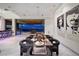 Contemporary dining room with modern chairs, a sleek table, and stunning city views through sliding glass doors at 621 Majestic Rim Dr, Henderson, NV 89012