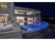 Modern luxury home with an infinity pool and expansive living spaces for seamless indoor-outdoor living at 621 Majestic Rim Dr, Henderson, NV 89012