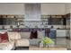 Open-concept kitchen with modern appliances, a large island, and seamlessly integrated living area at 621 Majestic Rim Dr, Henderson, NV 89012