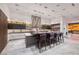 Bright, modern kitchen with a large island, stainless steel appliances, and stylish purple chairs at 621 Majestic Rim Dr, Henderson, NV 89012
