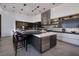 Modern kitchen featuring a large island with counter seating, stainless steel appliances, and sleek cabinetry at 621 Majestic Rim Dr, Henderson, NV 89012