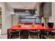 Modern kitchen featuring stainless steel appliances, sleek cabinetry, and a red island with bar seating at 621 Majestic Rim Dr, Henderson, NV 89012