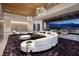 Elegant living room with stylish furniture, a statement chandelier, and an open transition to the outdoor space at 621 Majestic Rim Dr, Henderson, NV 89012