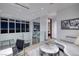 Contemporary loft living room featuring city views through expansive windows and modern furnishings at 621 Majestic Rim Dr, Henderson, NV 89012