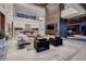 Open-concept living area with fireplace, comfortable seating, and seamless flow to other living spaces at 621 Majestic Rim Dr, Henderson, NV 89012