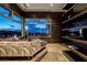Cozy living room with a large window, custom shelving, and comfortable seating offering city views at 621 Majestic Rim Dr, Henderson, NV 89012