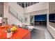 Bright living room area with modern decor, an open staircase, and cityscape views at 621 Majestic Rim Dr, Henderson, NV 89012