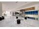 Expansive living room with sleek design elements and stunning city views through large windows at 621 Majestic Rim Dr, Henderson, NV 89012