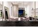 Bright primary bedroom with modern decor, comfortable bedding, and a terrace with city views at 621 Majestic Rim Dr, Henderson, NV 89012